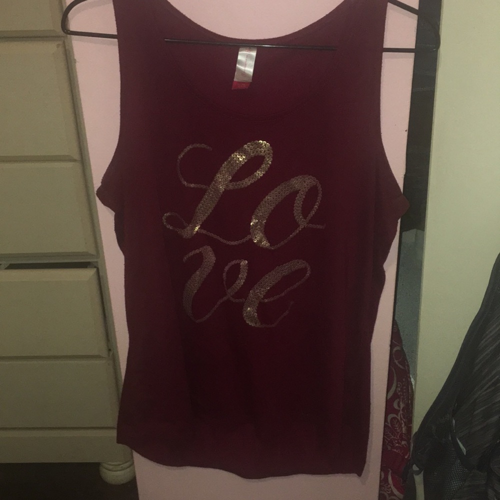burgundy tank top with letters.